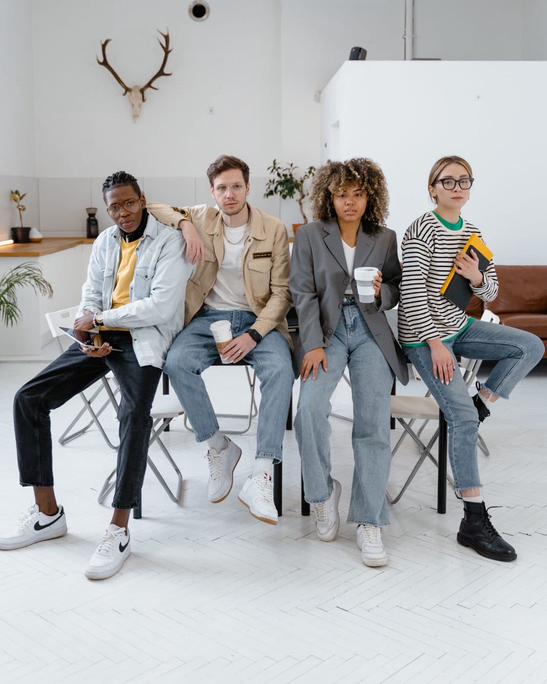 Four program participants sitting together in a bright community room